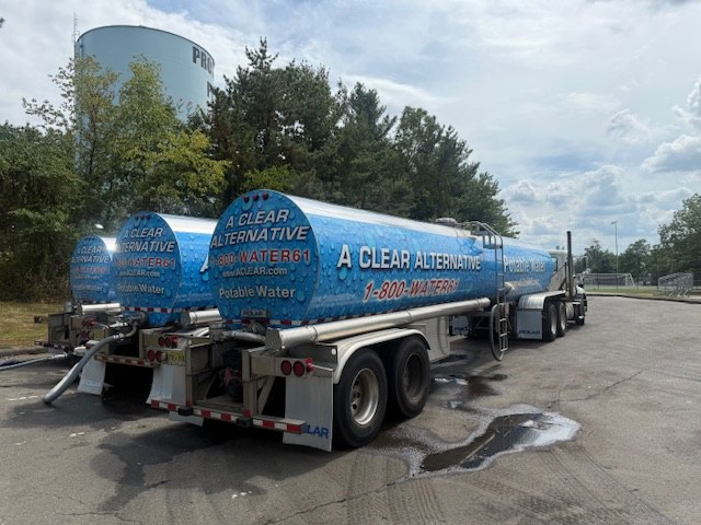 A Clear Alternative emergency water tanker on scene at a municipal outage — 6,200-gallon potable water delivery